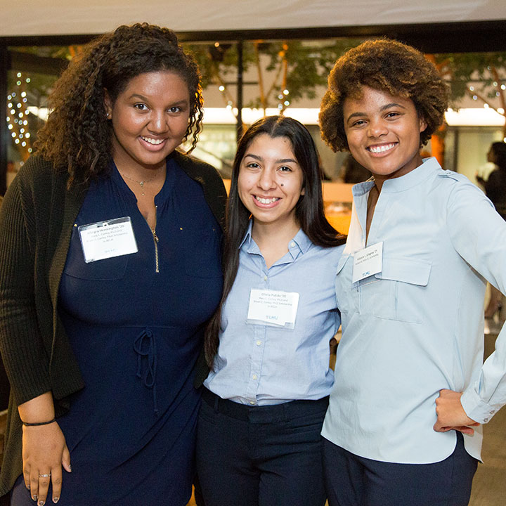 Three scholarship recipients at an event in Roski Dining Hall
