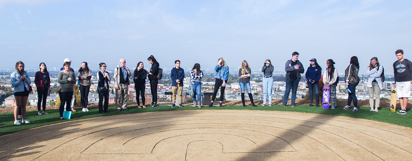 Students and faculty encircling the Labyrinth constructed as part of the Bellarmine Forums 2017 Slow Time Series