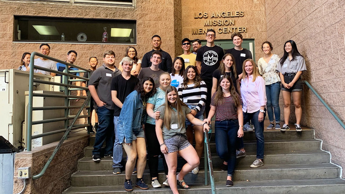 A group of students standing together in a stairwell