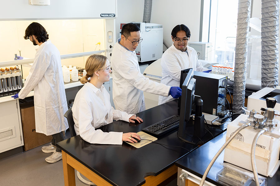 Students perform research in a lab on LMU's campus.