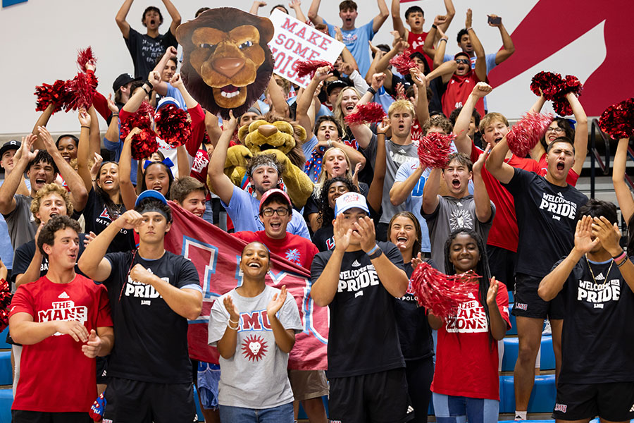 A crowd of students cheer inside Gersten Pavilion on LMU's campus.