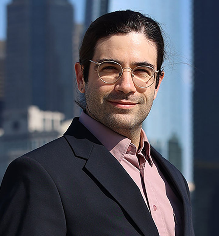David Randall, J.D. ’26, who pursued a mid-career transition to law school after discovering a love of advocacy, stands with downtown Los Angeles in the background.