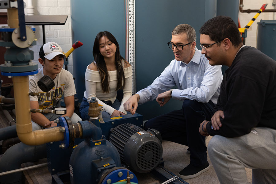 Seaver College professor John Petrie talks to students in the civil and environmental engineering lab.