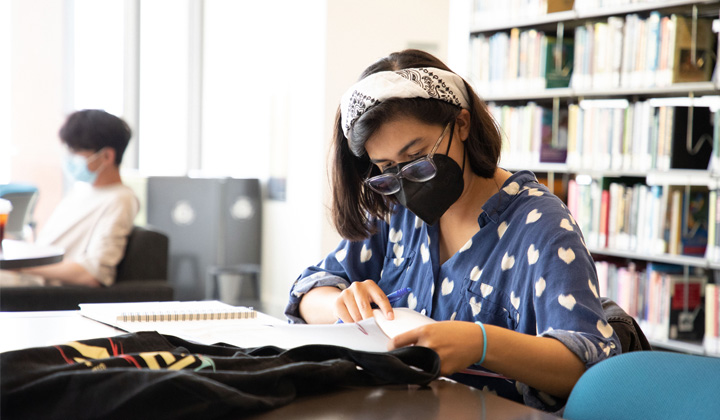 An LMU BIPOC student studies in the William H. Hannon Library