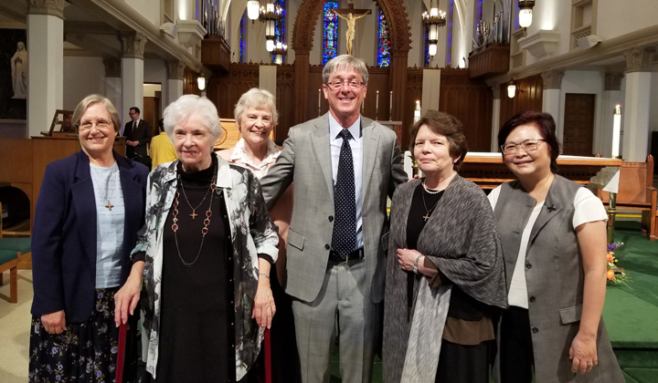 President Timothy Law Snyder, Ph.D., with the Sisters of St. Joseph of Orange in Sacred Heart Chapel